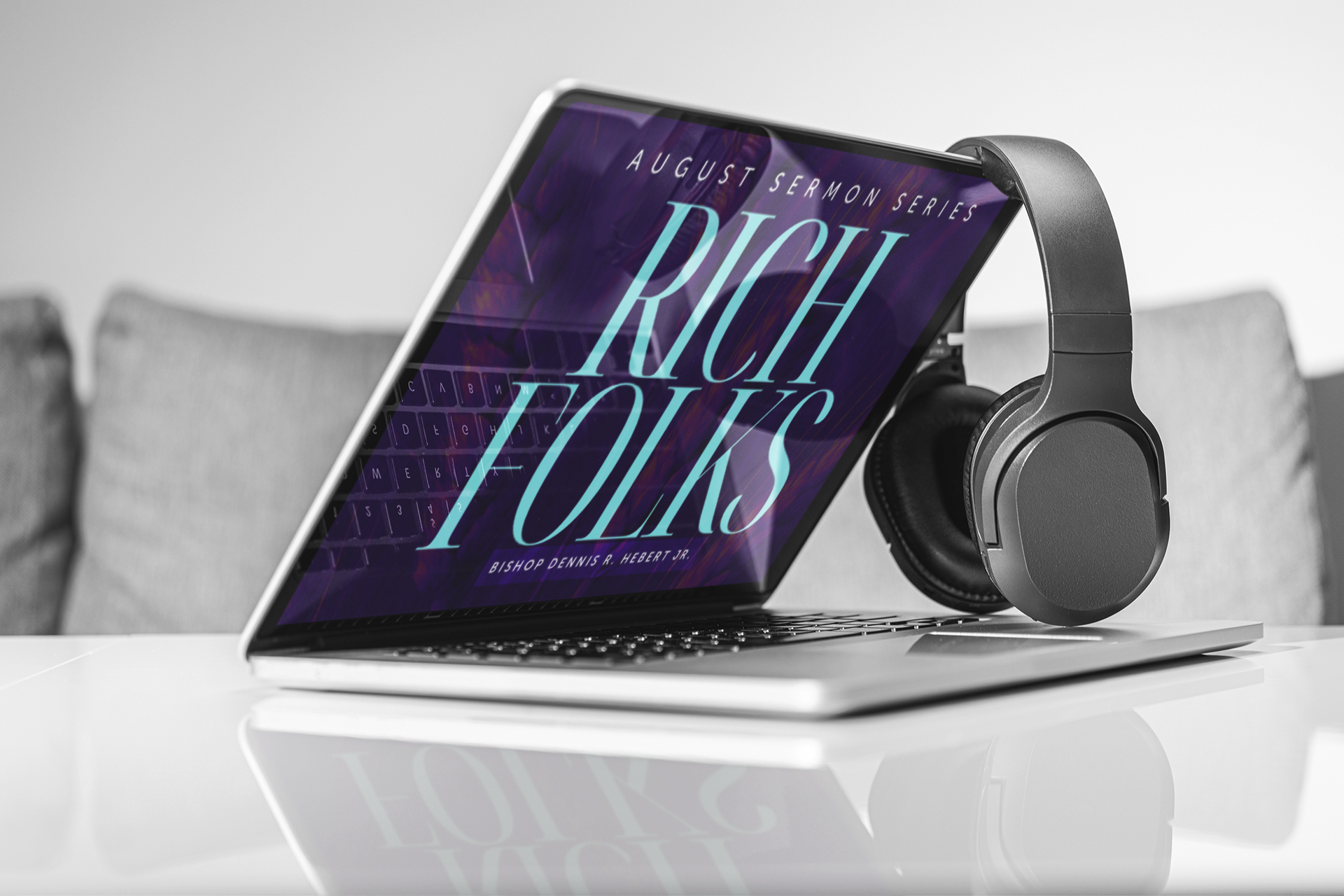 Rich Folks sermon series displayed on laptop with headphones